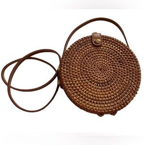 Rattan crossbody bag. Apparently sold at Urban Outfitters. Cute and brand new.